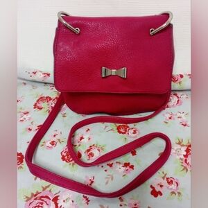 Candie's Vibrant Pink Crossbody Bag with Bow Accent